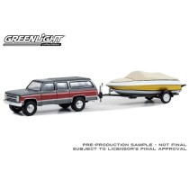 Greenlight Hitch and Tow Series 29 - 1987 Chevrolet Suburban K20 with Boat and Trailer